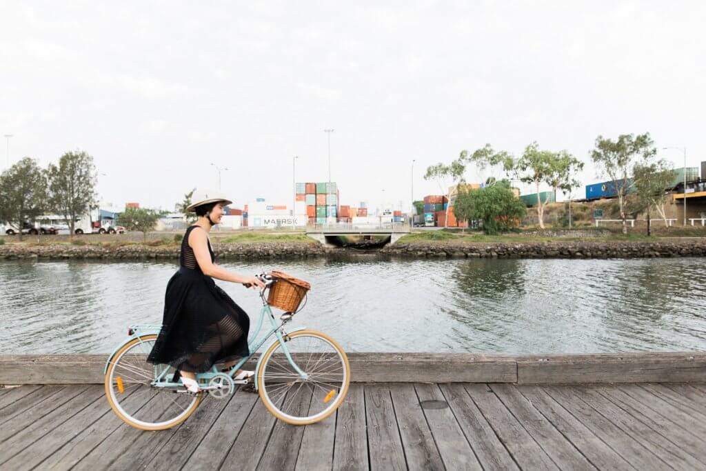 Woman cycling Maribyrnong River trail Footscray